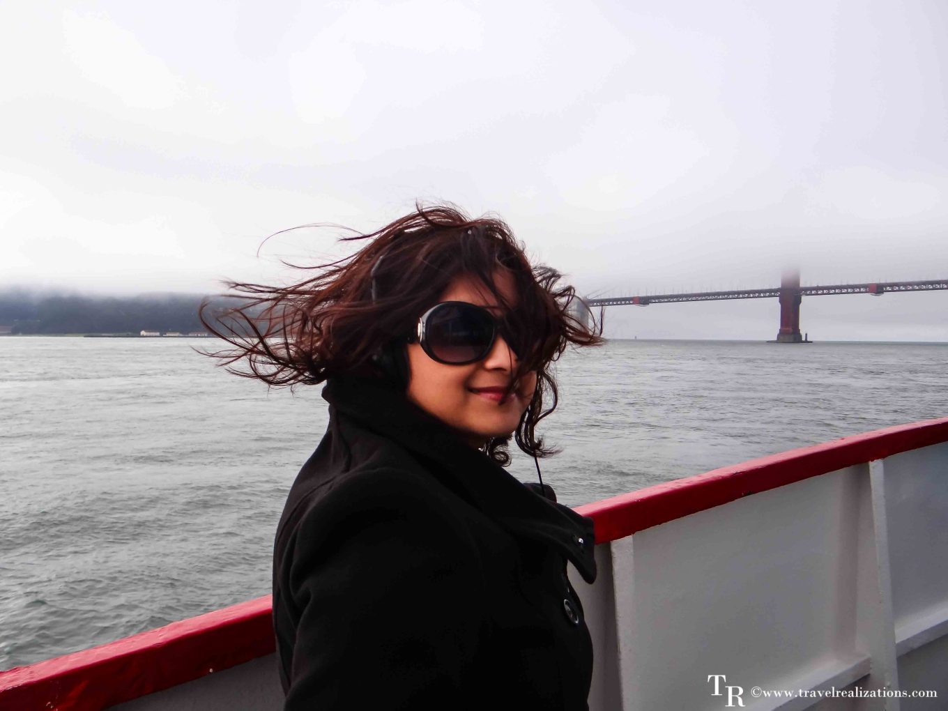 Crossing San Francisco Bay by ferry with the Golden Gate Bridge in the fog behind