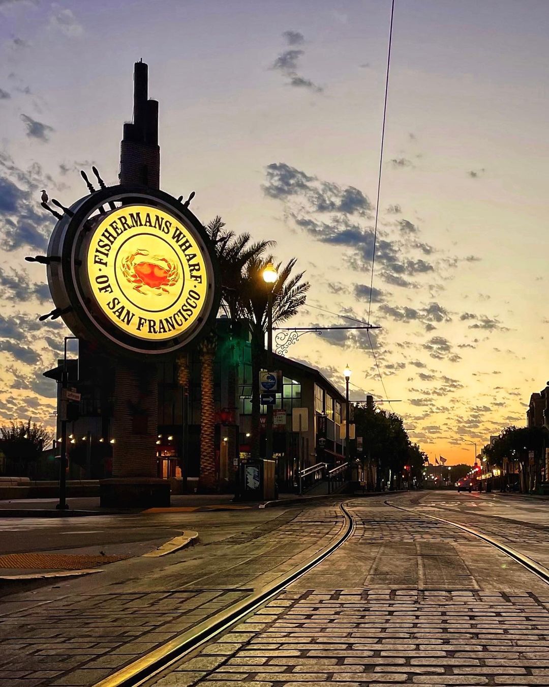 Illuminated Fisherman’s Wharf sign at dusk in San Francisco
