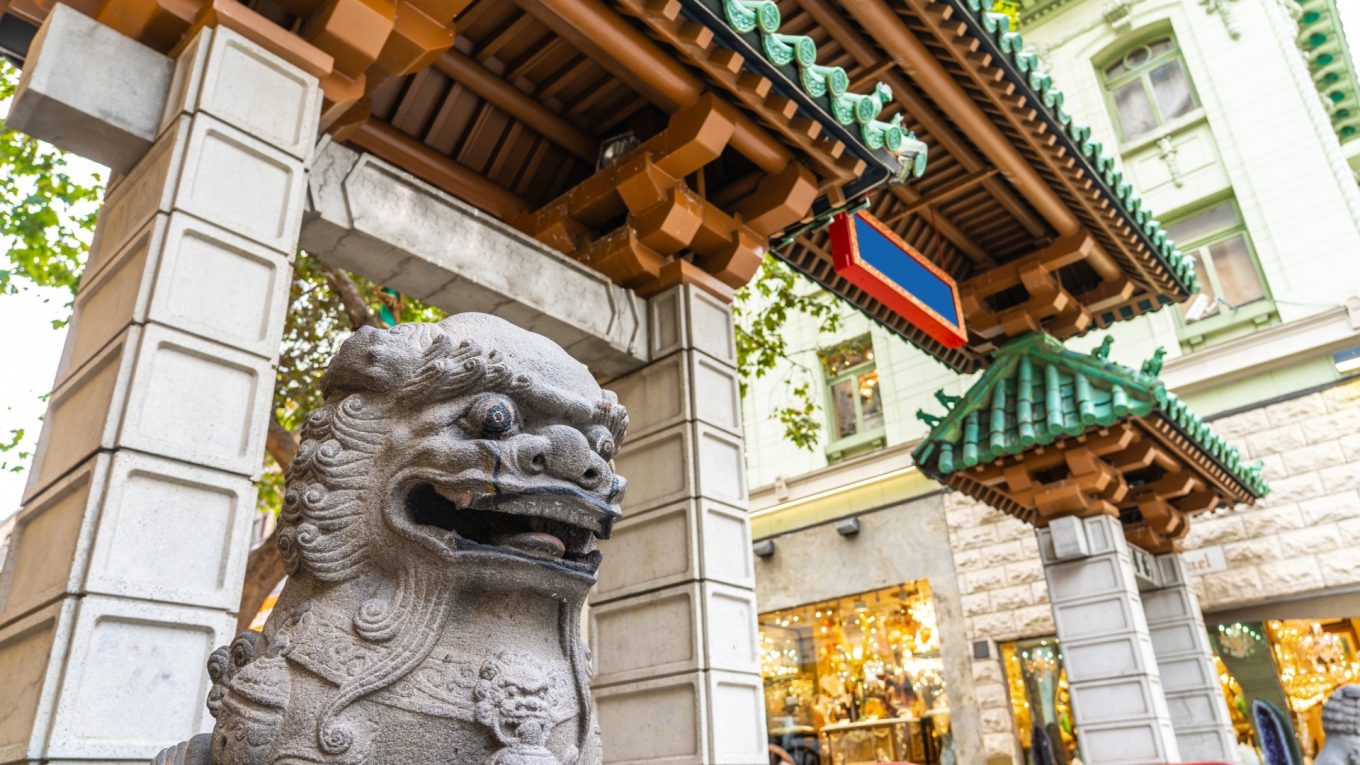 Stone guardian lion at the Dragon Gate entrance to San Francisco Chinatown